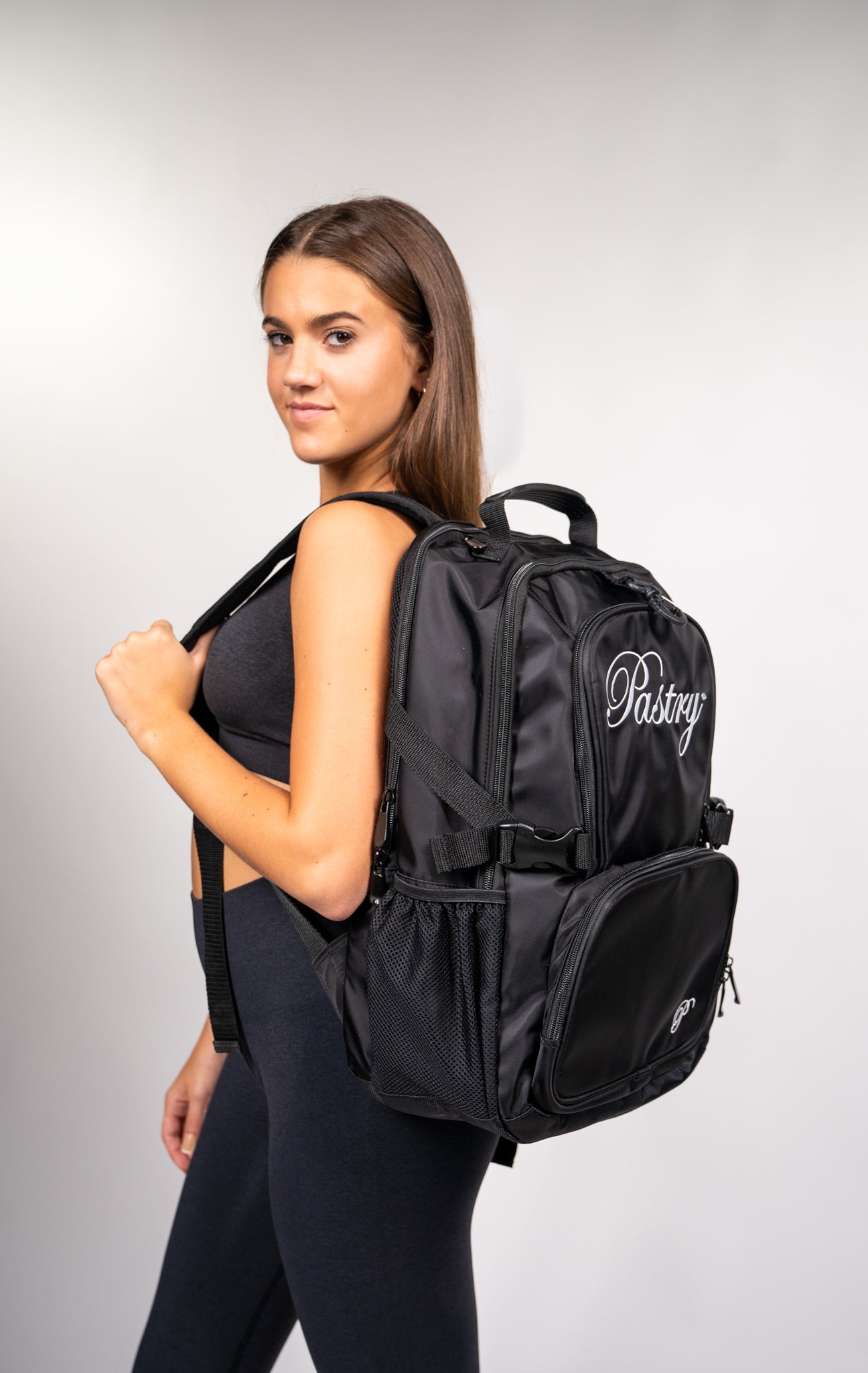 woman carrying Pastry Backpack Solid Black