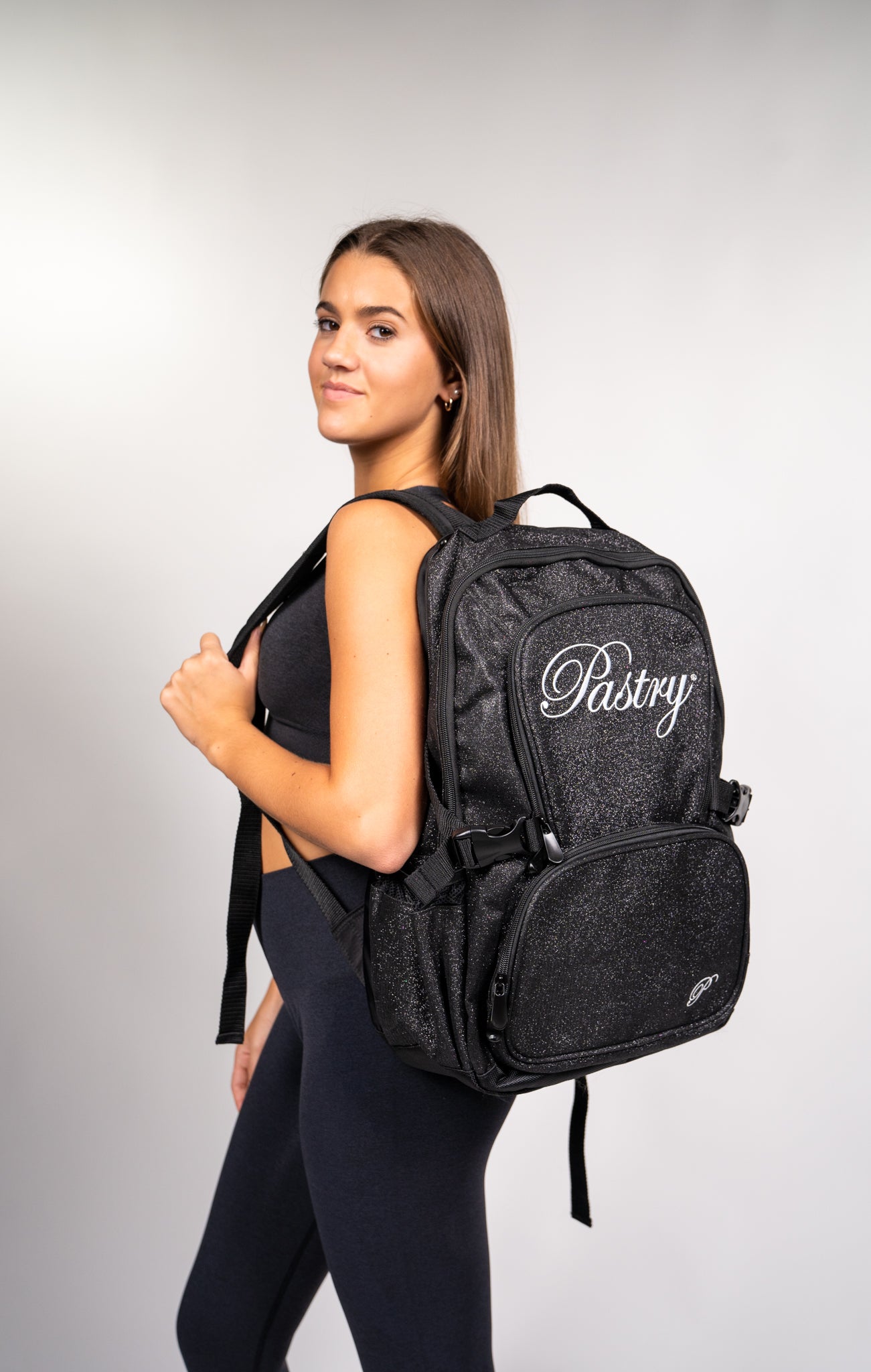 woman carrying Pastry Backpack Glitter Black