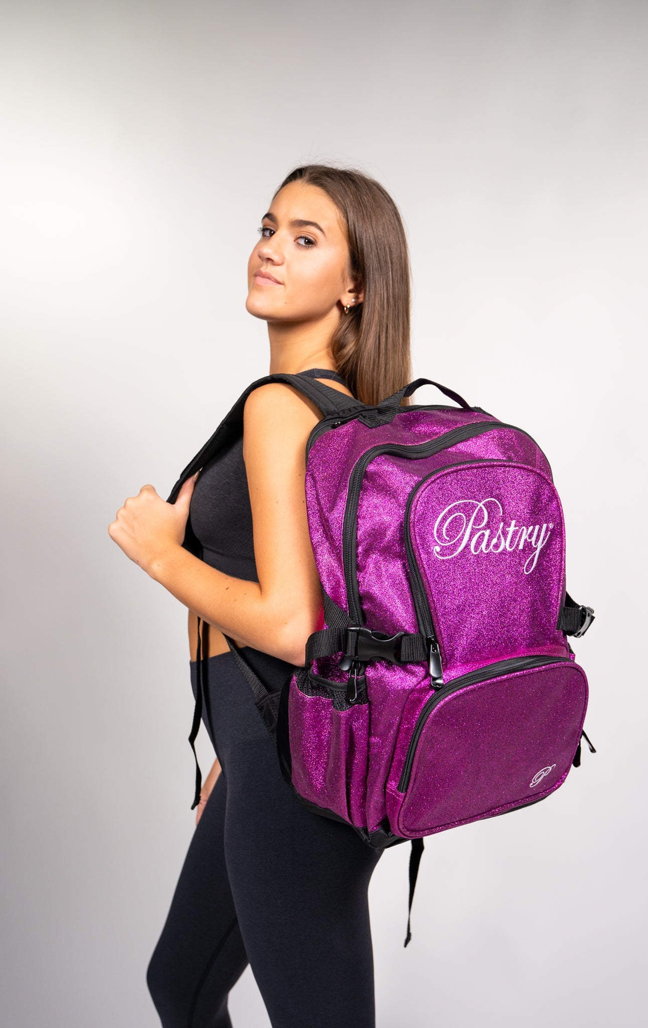 woman carrying Pastry Backpack Glitter Hot Pink