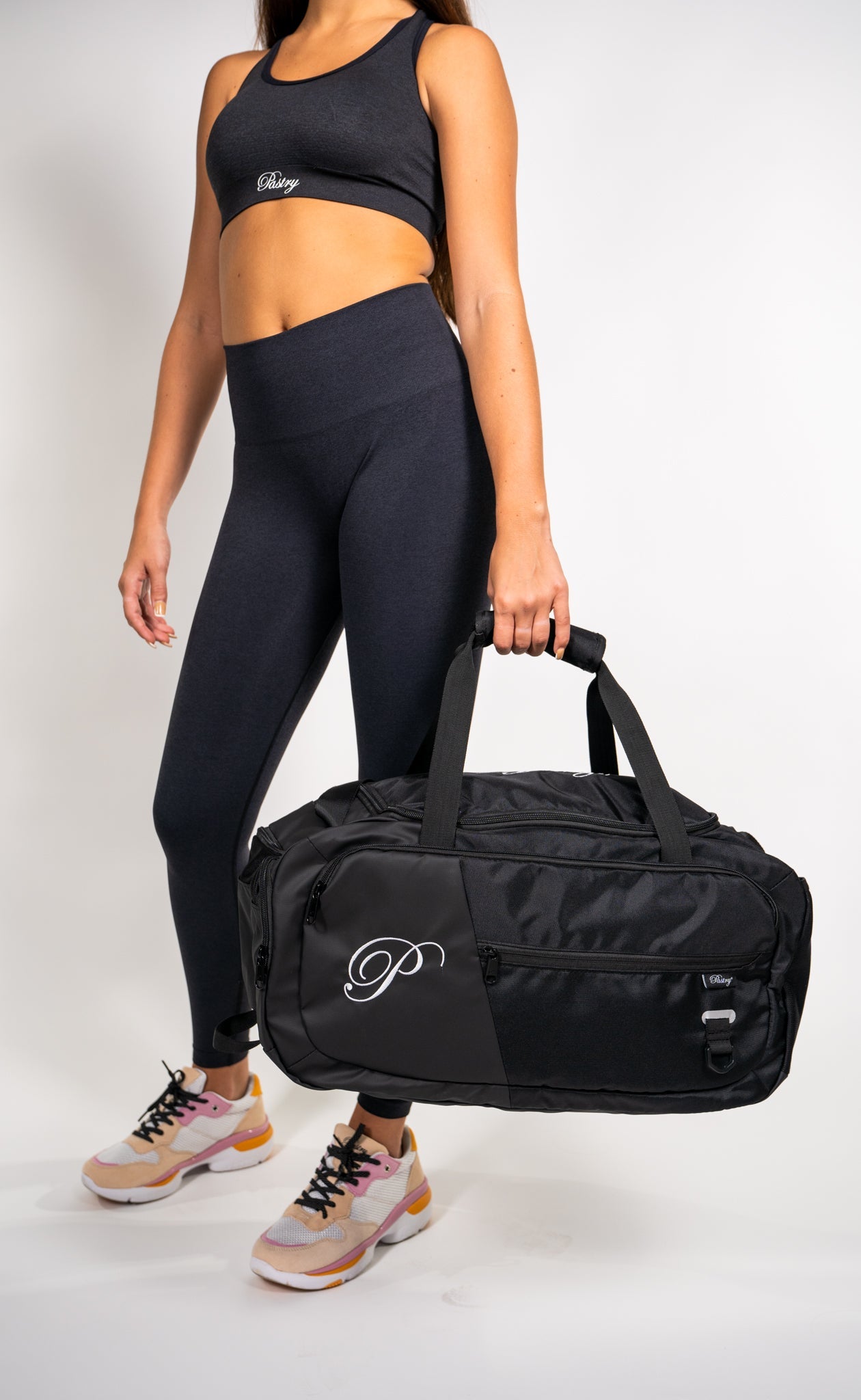Woman carrying Pastry Duffle Bag Solid Black