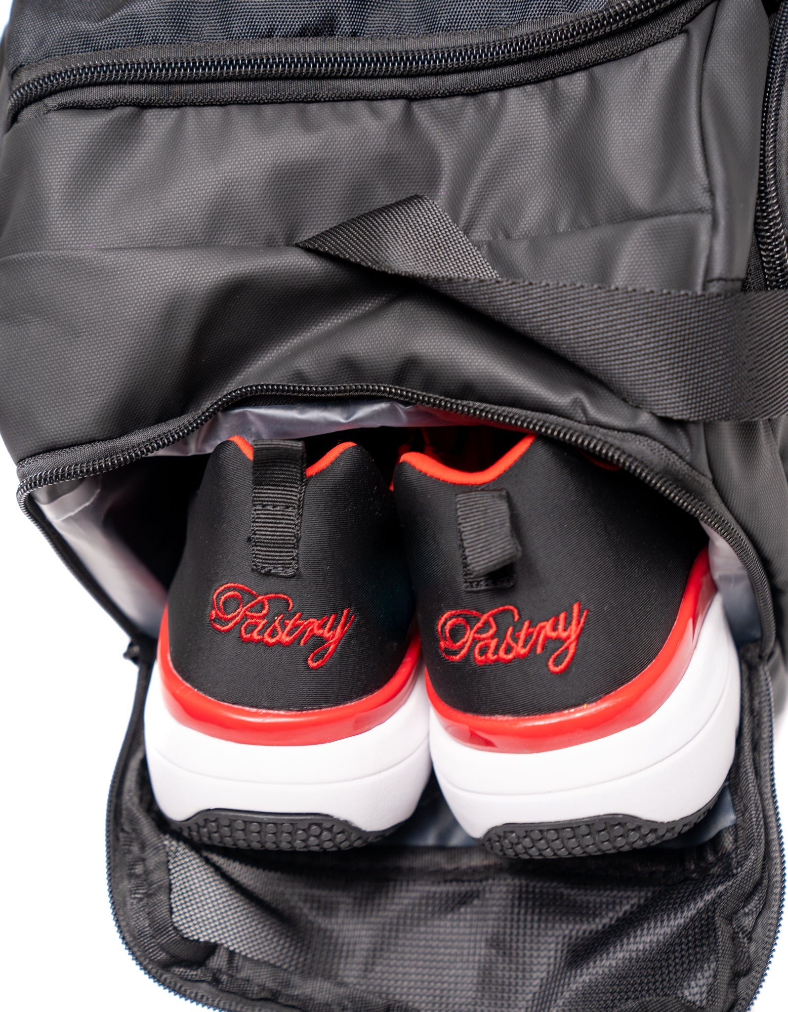 Pastry Duffle Bag Solid Black with shoes inside